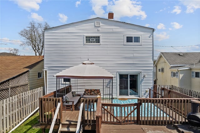 205 Cottage St, Neville Twp, PA 15225 - back of property featuring a deck, outdoor lounge area, a fenced backyard, and a chimney