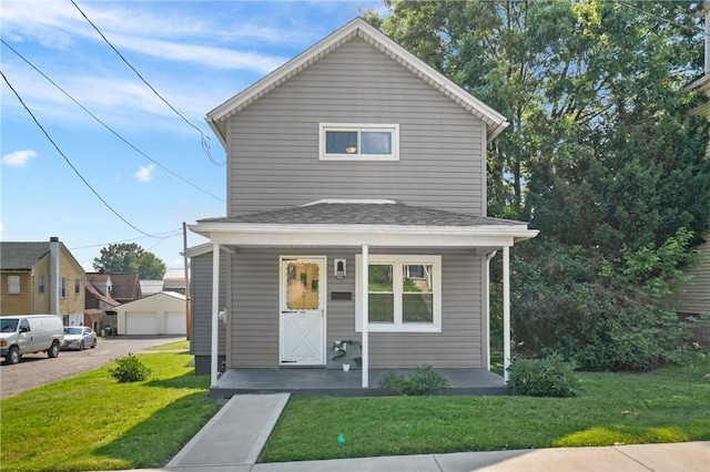 1723 Kimball Ave, Arnold, PA 15068 - view of front of property with covered porch, a front lawn, and a garage
