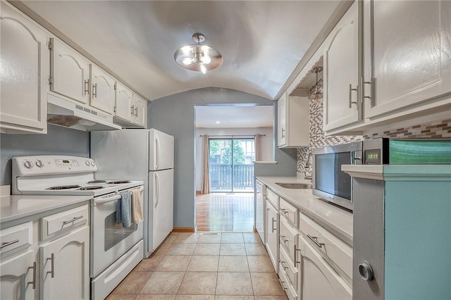 413 Allenberry Dr, Ross Twp, PA 15237 - kitchen with white electric stove, under cabinet range hood, light countertops, white cabinetry, and vaulted ceiling