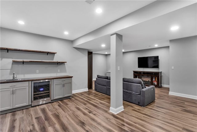 413 Cayuga Cir, Marshall, PA 16046 - indoor wet bar featuring wine cooler, wood finished floors, and recessed lighting