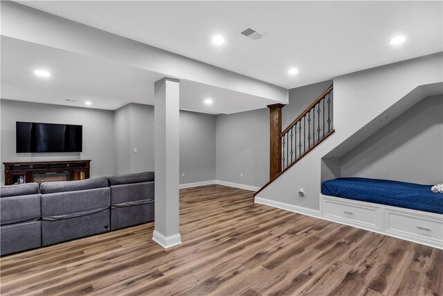 413 Cayuga Cir, Marshall, PA 16046 - unfurnished living room with wood finished floors, recessed lighting, and stairway
