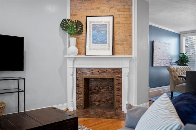 215 Emerson St, Shadyside, PA 15206 - living area with a fireplace, wood finished floors, and crown molding