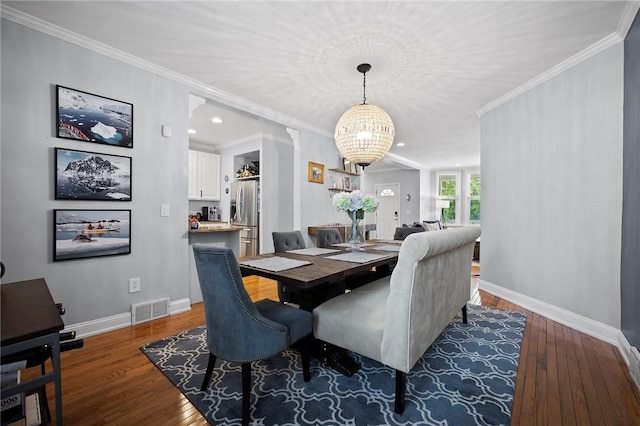 215 Emerson St, Shadyside, PA 15206 - dining area featuring a chandelier, wood finished floors, crown molding, and recessed lighting