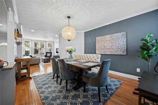 215 Emerson St, Shadyside, PA 15206 - dining space featuring hardwood / wood-style flooring, crown molding, and recessed lighting