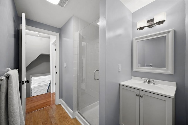 215 Emerson St, Shadyside, PA 15206 - full bath with a stall shower, wood finished floors, and vanity