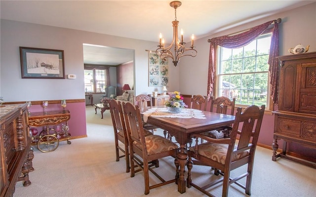 32 Dunham Dr, Hempfield Twp Wml, PA 15601 - dining room featuring light colored carpet and a chandelier