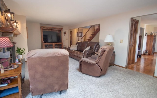 32 Dunham Dr, Hempfield Twp Wml, PA 15601 - carpeted living area featuring stairs and baseboards