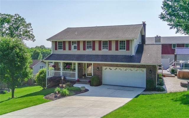 32 Dunham Dr, Hempfield Twp Wml, PA 15601 - traditional home featuring a porch, concrete driveway, a front lawn, brick siding, and an attached garage