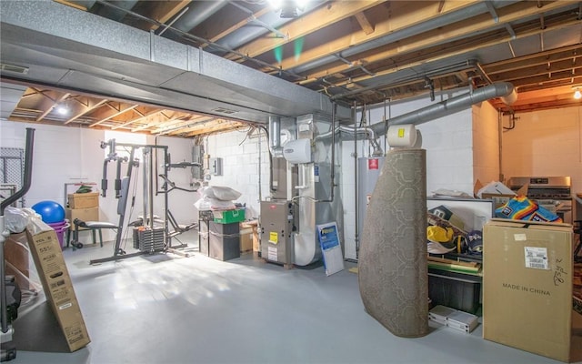 32 Dunham Dr, Hempfield Twp Wml, PA 15601 - unfinished basement with gas water heater, heating unit, and concrete block wall