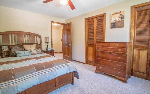 32 Dunham Dr, Hempfield Twp Wml, PA 15601 - bedroom with light carpet, ceiling fan, and two closets