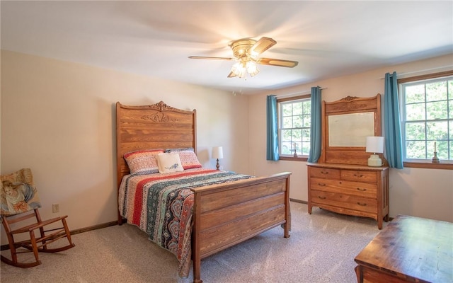 32 Dunham Dr, Hempfield Twp Wml, PA 15601 - carpeted bedroom featuring multiple windows and a ceiling fan