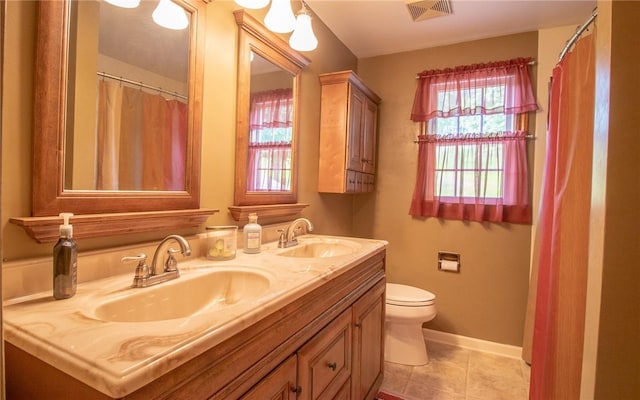32 Dunham Dr, Hempfield Twp Wml, PA 15601 - bathroom featuring double vanity and tile patterned flooring