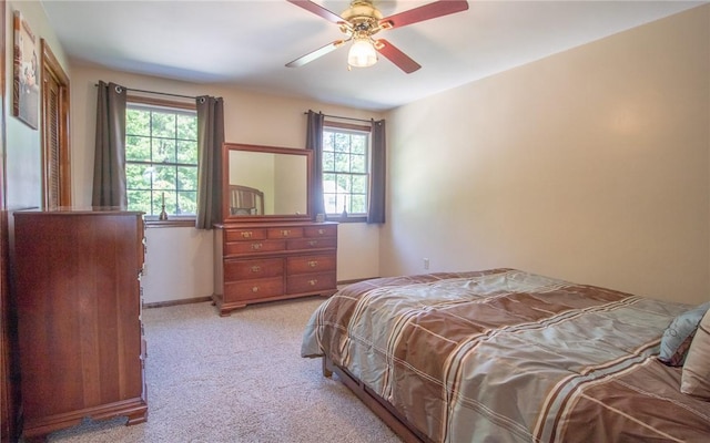 32 Dunham Dr, Hempfield Twp Wml, PA 15601 - carpeted bedroom with multiple windows and ceiling fan