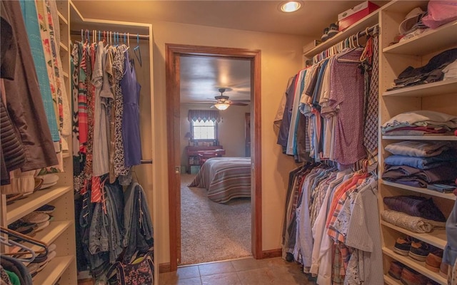 32 Dunham Dr, Hempfield Twp Wml, PA 15601 - spacious closet featuring a ceiling fan, carpet floors, and tile patterned flooring