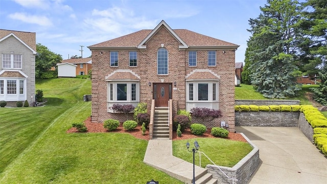 110 Northgate, West Mifflin, PA 15122 - view of front of home with brick siding and a front yard