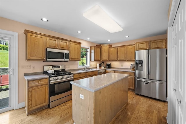 110 Northgate, West Mifflin, PA 15122 - kitchen with stainless steel appliances, light wood finished floors, a center island, brown cabinets, and recessed lighting