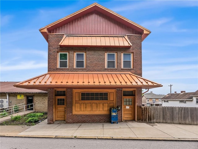 1556 Island Ave, Stowe Twp, PA 15136 - view of front of home with a standing seam roof, brick siding, and a metal roof