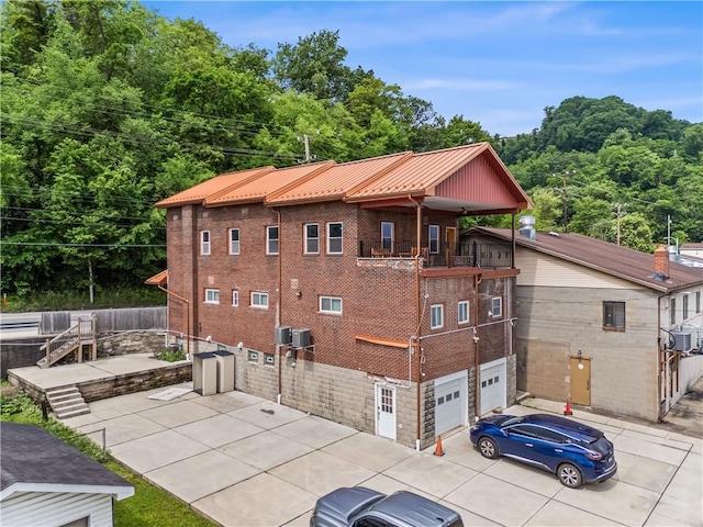 1556 Island Ave, Stowe Twp, PA 15136 - view of building exterior with concrete driveway and a garage