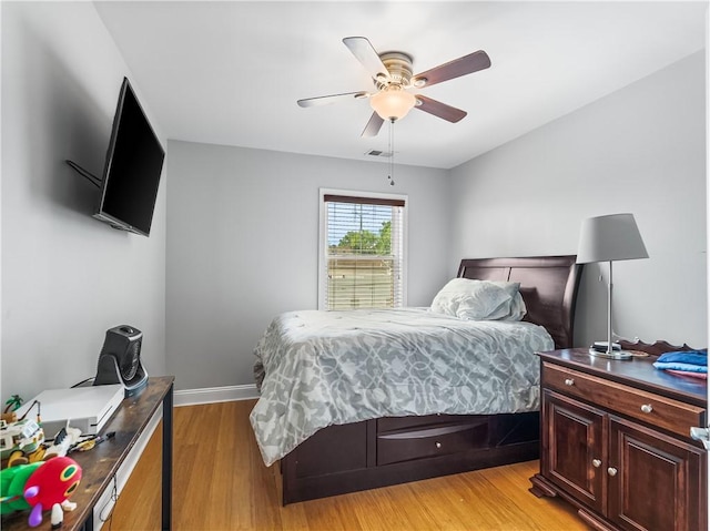 1556 Island Ave, Stowe Twp, PA 15136 - bedroom with light wood-style flooring, a ceiling fan, and an office area