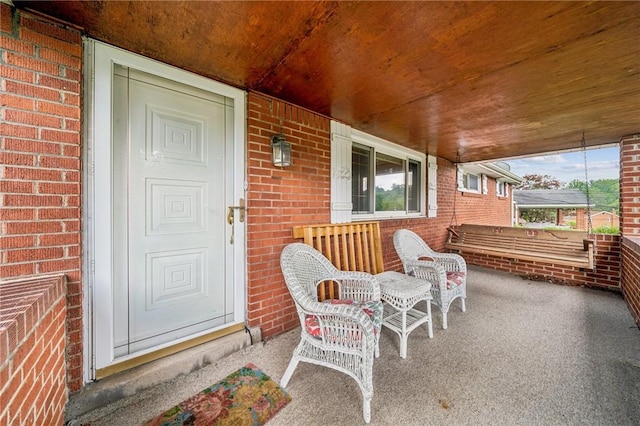 23 Corbett Ave, Hempfield Twp Wml, PA 15642 - property entrance with covered porch and brick siding