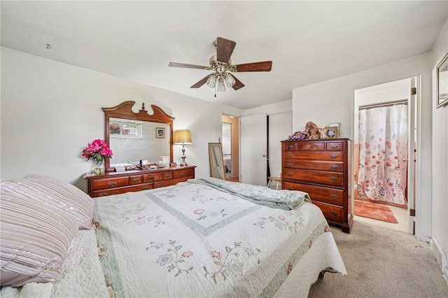 23 Corbett Ave, Hempfield Twp Wml, PA 15642 - bedroom with light colored carpet, a closet, ceiling fan, and ensuite bathroom