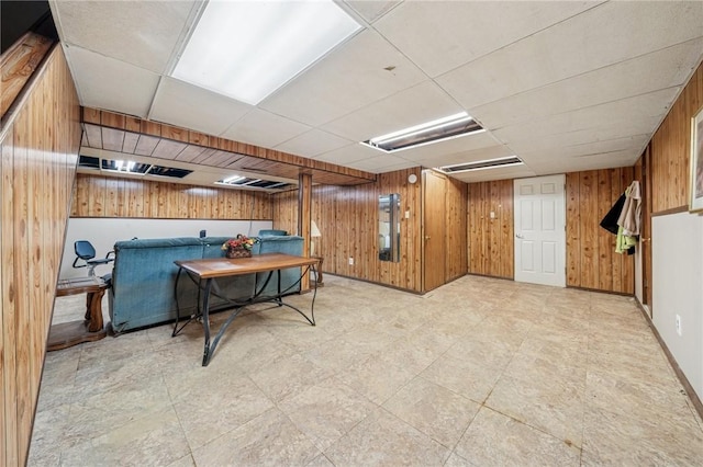 23 Corbett Ave, Hempfield Twp Wml, PA 15642 - playroom featuring wood walls, a drop ceiling, and tile patterned floors