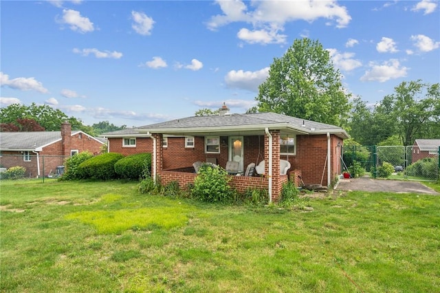 23 Corbett Ave, Hempfield Twp Wml, PA 15642 - rear view of house featuring brick siding and a chimney