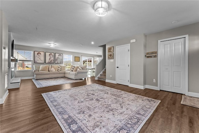 226 Stevens Ct, South Strabane, PA 15301 - living room featuring stairs and dark wood-type flooring