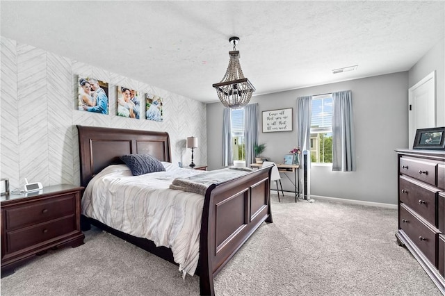 226 Stevens Ct, South Strabane, PA 15301 - bedroom with wallpapered walls, light carpet, a chandelier, and a textured ceiling