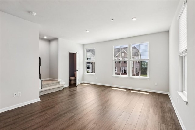489 Nolan Cir, Cranberry Twp, PA 16066 - unfurnished living room featuring dark wood-style floors and stairs