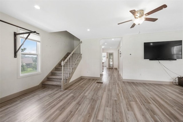 1431 Monastery Dr, Latrobe, PA 15650 - unfurnished living room with stairway, light wood-type flooring, a ceiling fan, and recessed lighting