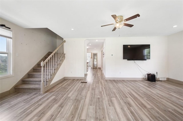 1431 Monastery Dr, Latrobe, PA 15650 - unfurnished living room with stairway, wood finished floors, a ceiling fan, and recessed lighting