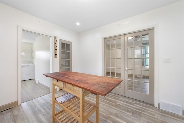 1431 Monastery Dr, Latrobe, PA 15650 - dining area with washer / clothes dryer, french doors, light wood-style floors, and recessed lighting