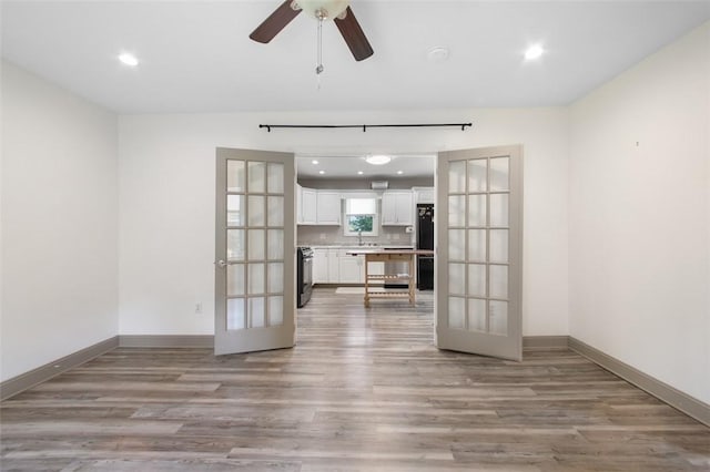 1431 Monastery Dr, Latrobe, PA 15650 - unfurnished living room with french doors, light wood-type flooring, recessed lighting, and ceiling fan