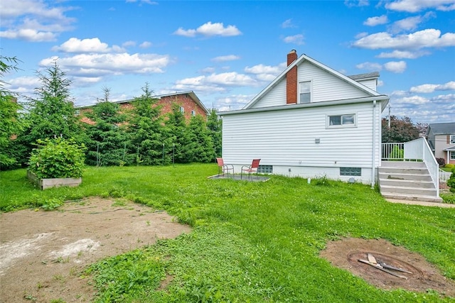 1431 Monastery Dr, Latrobe, PA 15650 - rear view of property with a chimney, a yard, and a wooden deck