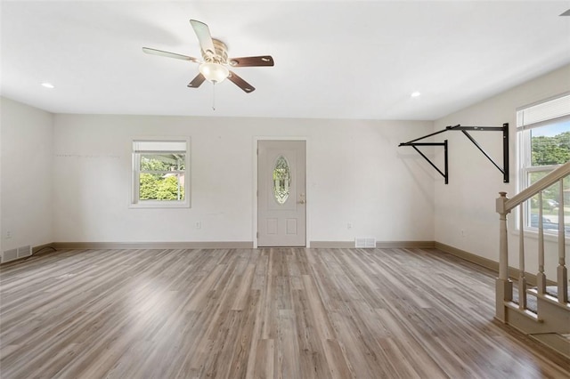 1431 Monastery Dr, Latrobe, PA 15650 - unfurnished living room featuring stairway, light wood-style flooring, ceiling fan, and recessed lighting
