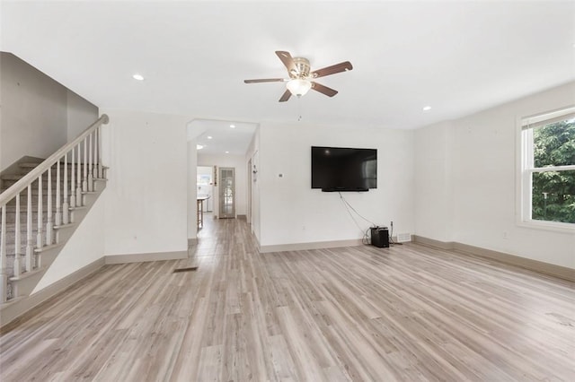 1431 Monastery Dr, Latrobe, PA 15650 - unfurnished living room featuring light wood-type flooring, stairway, ceiling fan, and recessed lighting
