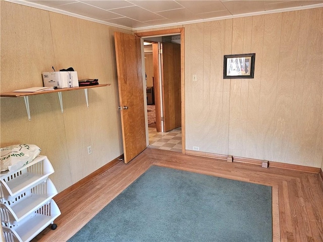 418 S Main St, Slippery Rock Boro, PA 16057 - spare room featuring wood finished floors, wood walls, and ornamental molding