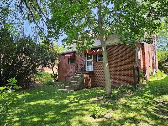 418 S Main St, Slippery Rock Boro, PA 16057 - rear view of property with a yard and brick siding