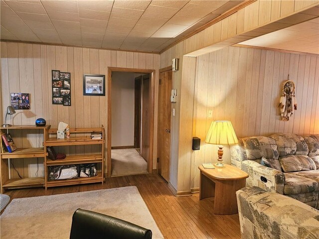 418 S Main St, Slippery Rock Boro, PA 16057 - living area featuring wooden walls, hardwood / wood-style floors, and crown molding