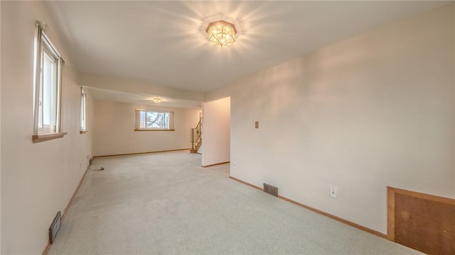 11297 Highpoint Dr, Penn Hills, PA 15235 - spare room featuring baseboards and light carpet