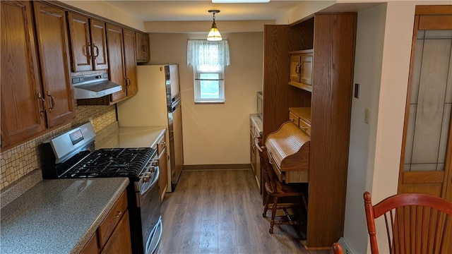 11297 Highpoint Dr, Penn Hills, PA 15235 - kitchen with stainless steel gas range oven, range hood, decorative backsplash, dark wood finished floors, and hanging light fixtures