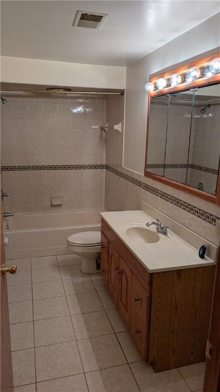 11297 Highpoint Dr, Penn Hills, PA 15235 - bathroom featuring vanity, tile patterned floors, and shower / bathtub combination