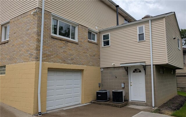 11297 Highpoint Dr, Penn Hills, PA 15235 - back of house featuring a garage