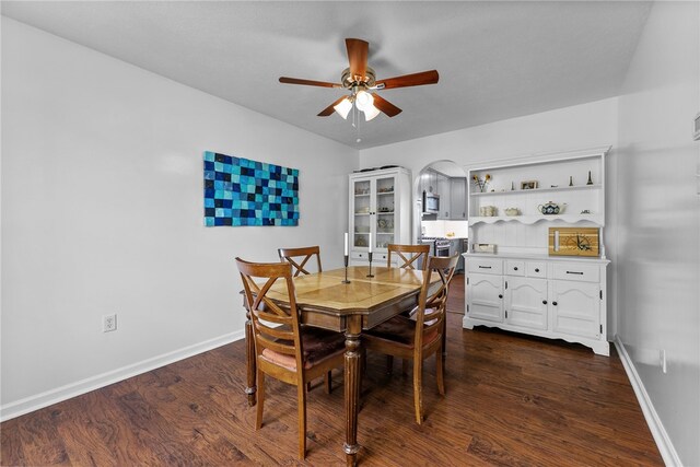 1020 Granite Dr, South Fayette, PA 15057 - dining room with a ceiling fan, arched walkways, and dark wood finished floors