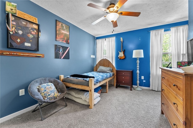 1020 Granite Dr, South Fayette, PA 15057 - carpeted bedroom with a textured ceiling, multiple windows, and a ceiling fan