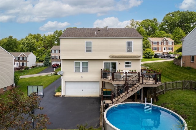 1020 Granite Dr, South Fayette, PA 15057 - back of property with a deck, stairs, a garage, and a residential view