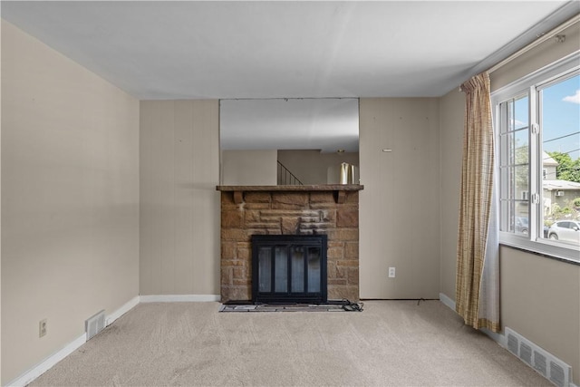 1031 Stratmore St, Ingram, PA 15205 - unfurnished living room with carpet floors, plenty of natural light, and a stone fireplace