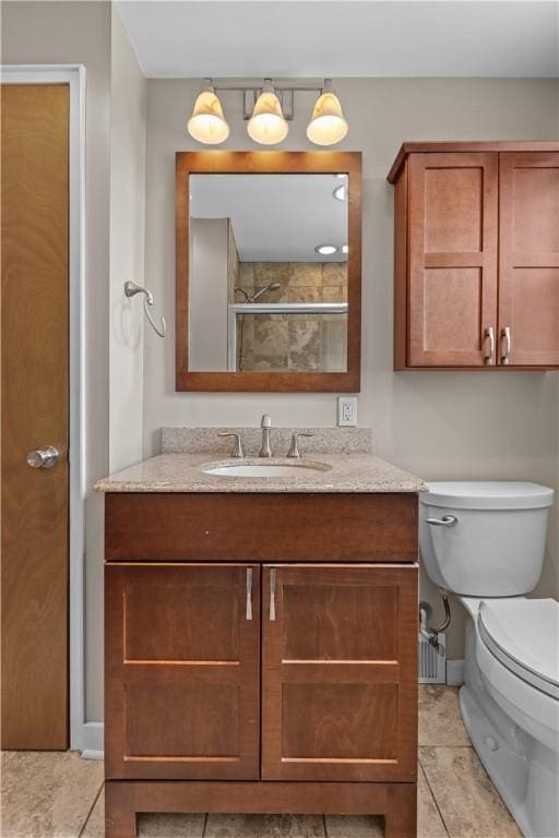 1031 Stratmore St, Ingram, PA 15205 - bathroom featuring vanity, tile patterned floors, and a tile shower