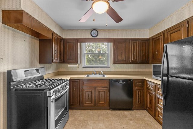 1031 Stratmore St, Ingram, PA 15205 - kitchen featuring black appliances, wallpapered walls, light countertops, and ceiling fan